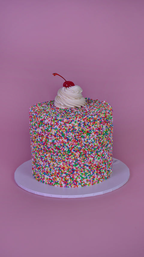 Sprinkle Dream Cake with Cherry.