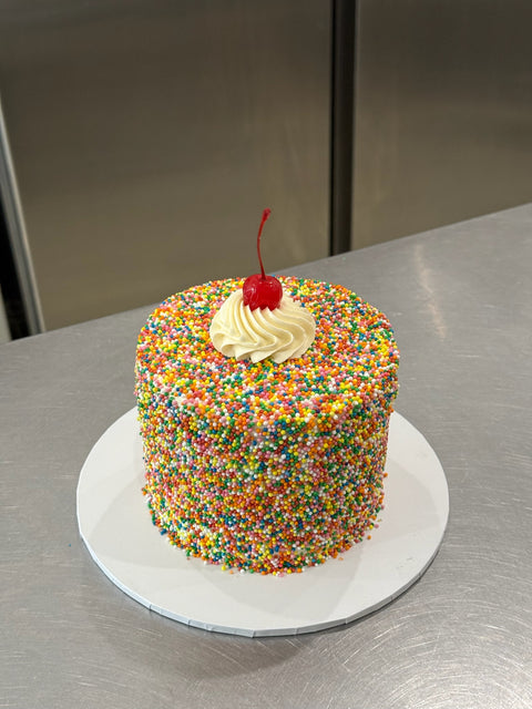 Sprinkle Dream Cake with Cherry.