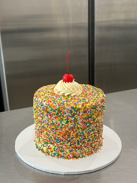 Sprinkle Dream Cake with Cherry.